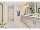 Large bathroom with modern fixtures, dual vanity and frameless shower at 1127 W Harvard St, Orlando, FL 32804