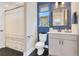 Updated bathroom features modern vanity, black hexagon tile and stylish decor at 1127 W Harvard St, Orlando, FL 32804