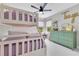 Bright bedroom featuring bunk beds, a green dresser, and a custom sign at 1127 W Harvard St, Orlando, FL 32804