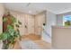 Hallway with beautiful hardwood flooring, plants and natural light at 1127 W Harvard St, Orlando, FL 32804
