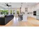Open-concept kitchen with stainless steel appliances, a kitchen island, and backyard views at 1127 W Harvard St, Orlando, FL 32804