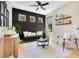 Modern living room with wood floors, dark accent wall, comfortable seating, and abundant natural light creating a cozy ambiance at 1127 W Harvard St, Orlando, FL 32804