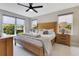 Bright main bedroom with large windows, stylish decor and ceiling fan at 1127 W Harvard St, Orlando, FL 32804