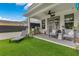Covered patio with outdoor kitchen, dining area and seating offers a space for relaxation and entertainment at 1127 W Harvard St, Orlando, FL 32804