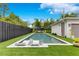 Inviting backyard pool with lounge chairs, set in a beautifully landscaped yard with privacy fence at 1127 W Harvard St, Orlando, FL 32804