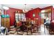 Traditional dining room with elegant chandelier and patterned tile flooring at 114 Floral Dr, Kissimmee, FL 34743