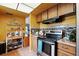 Functional kitchen featuring wood cabinetry and stainless steel appliances at 114 Floral Dr, Kissimmee, FL 34743