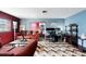 Inviting living area with eclectic decor, comfortable seating, and a dedicated workspace at 114 Floral Dr, Kissimmee, FL 34743