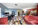 Spacious living area with unique flooring and access to dining area at 114 Floral Dr, Kissimmee, FL 34743
