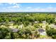 An aerial view of a charming neighborhood with mature trees, manicured lawns, and a sense of community and home at 1204 Howell Creek Dr, Winter Springs, FL 32708