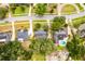 Aerial view of the neighborhood showcasing the layout of homes with pools and green spaces under a sunny sky at 1204 Howell Creek Dr, Winter Springs, FL 32708