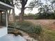 Expansive backyard with mature trees, lush landscaping, and a serene setting for outdoor activities at 1204 Howell Creek Dr, Winter Springs, FL 32708