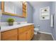 Charming bathroom with wood vanity, modern fixtures, and ample cabinet space at 1204 Howell Creek Dr, Winter Springs, FL 32708