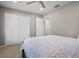 Bright bedroom features a patterned bedspread and large closet for ample storage at 1204 Howell Creek Dr, Winter Springs, FL 32708