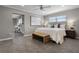 Bedroom featuring an open layout, hard floors, a bench, and soft, natural lighting at 1204 Howell Creek Dr, Winter Springs, FL 32708