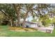Exterior view showcasing a well-maintained home with a two-car garage and a driveway leading to a basketball hoop at 1204 Howell Creek Dr, Winter Springs, FL 32708