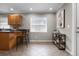 Eat-in kitchen featuring wooden cabinets, breakfast bar, and tile flooring at 1204 Howell Creek Dr, Winter Springs, FL 32708