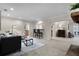 Open floor plan with living area, bar seating and view to kitchen at 1204 Howell Creek Dr, Winter Springs, FL 32708
