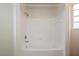 Bright bathroom featuring a shower and tub combination with neutral tiling and fixtures at 122 Vista Verdi Cir # 236, Lake Mary, FL 32746