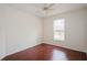 Bedroom with hardwood floors, ceiling fan, and bright window for natural light at 122 Vista Verdi Cir # 236, Lake Mary, FL 32746