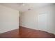 Spacious bedroom featuring hardwood floors, a ceiling fan, and a closet at 122 Vista Verdi Cir # 236, Lake Mary, FL 32746