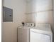 Functional laundry room equipped with a washer, dryer, and storage shelf at 122 Vista Verdi Cir # 236, Lake Mary, FL 32746
