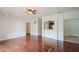 Open living area with hardwood floors, ceiling fan, and an opening to the kitchen at 122 Vista Verdi Cir # 236, Lake Mary, FL 32746