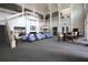 Bright lobby showcasing a grand staircase, comfortable seating, and soaring ceilings at 122 Vista Verdi Cir # 236, Lake Mary, FL 32746