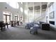 Expansive lobby featuring comfortable seating, a fireplace, and elegant architectural details at 122 Vista Verdi Cir # 236, Lake Mary, FL 32746
