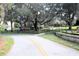 Scenic pathway with a playground under mature trees in a beautiful landscaped neighborhood at 122 Vista Verdi Cir # 236, Lake Mary, FL 32746
