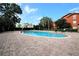 Community pool surrounded by trees, offering a refreshing retreat for residents at 122 Vista Verdi Cir # 236, Lake Mary, FL 32746
