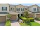 Overhead view of an attractive home boasting well-maintained landscaping and a convenient attached garage at 13993 Tarvin St, Orlando, FL 32832