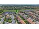 Aerial view highlighting the property's location near a golf course, ponds, and residential neighborhood at 13993 Tarvin St, Orlando, FL 32832