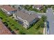 Townhouse backyard features a screened-in patio, green lawn, and landscaped surroundings at 13993 Tarvin St, Orlando, FL 32832