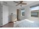 Bedroom has a ceiling fan, two windows, and a chest of drawers at 13993 Tarvin St, Orlando, FL 32832