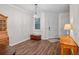 Welcoming foyer features wood floors, a chandelier, and a charming accent table at 13993 Tarvin St, Orlando, FL 32832