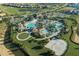 Aerial view of resort style community featuring a sandy volleyball court at 1466 Moon Valley Dr, Champions Gate, FL 33896