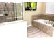 Bright bathroom with large tub and decorative tile at 1466 Moon Valley Dr, Champions Gate, FL 33896