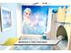 Bedroom with Elsa Frozen decor, mural and custom bunk beds at 1466 Moon Valley Dr, Champions Gate, FL 33896