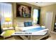 Bright bedroom with a king-size bed, stylish lamps, and ample natural light at 1466 Moon Valley Dr, Champions Gate, FL 33896