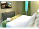 Comfortable bedroom with a king-size bed, TV, and bright natural light at 1466 Moon Valley Dr, Champions Gate, FL 33896