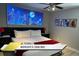 Primary bedroom with a king-sized bed, side tables, and Spider-Personal themed decor at 1466 Moon Valley Dr, Champions Gate, FL 33896