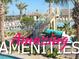 Community pool featuring a waterslide, lounging area, tropical landscaping, and Gathering fun at 1466 Moon Valley Dr, Champions Gate, FL 33896