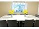 Open dining area with a large table, seating for ten, and disney themed wall art at 1466 Moon Valley Dr, Champions Gate, FL 33896