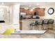 Modern kitchen with stainless steel appliances and breakfast bar at 1466 Moon Valley Dr, Champions Gate, FL 33896