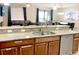 Kitchen with custom cabinets, granite countertops and dining area at 1466 Moon Valley Dr, Champions Gate, FL 33896