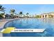 Resort-style pool with a tranquil atmosphere, featuring ample seating and lush tropical surroundings at 1466 Moon Valley Dr, Champions Gate, FL 33896