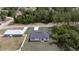 An aerial shot of the home showcasing its location, roof, and surrounding greenery at 16600 Sw 23Rd Avenue Rd, Ocala, FL 34473