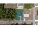 Drone shot of the house and neighboring plots, surrounded by lush trees and vegetation at 16600 Sw 23Rd Avenue Rd, Ocala, FL 34473