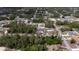 A high angle neighborhood view showcasing the home's placement in a wooded residential area at 16600 Sw 23Rd Avenue Rd, Ocala, FL 34473